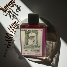 Shut Your Mouth Wish Oil ritual oil bottle for stopping rumors, calming harmful talk, and spiritual practice.