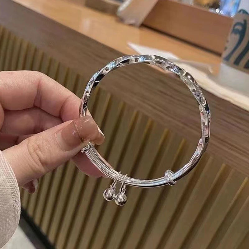 Silver Dreamcatcher Charm adjustable bangle with pendant charm for daily accessorizing, stacking, and fashion wear.