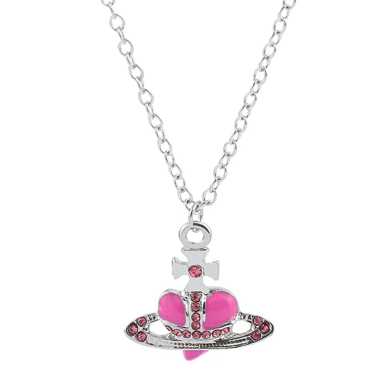 Trendy Silver Heart & Saturn Pendant necklace for celestial fashion looks, casual wear, and layering with other jewelry.