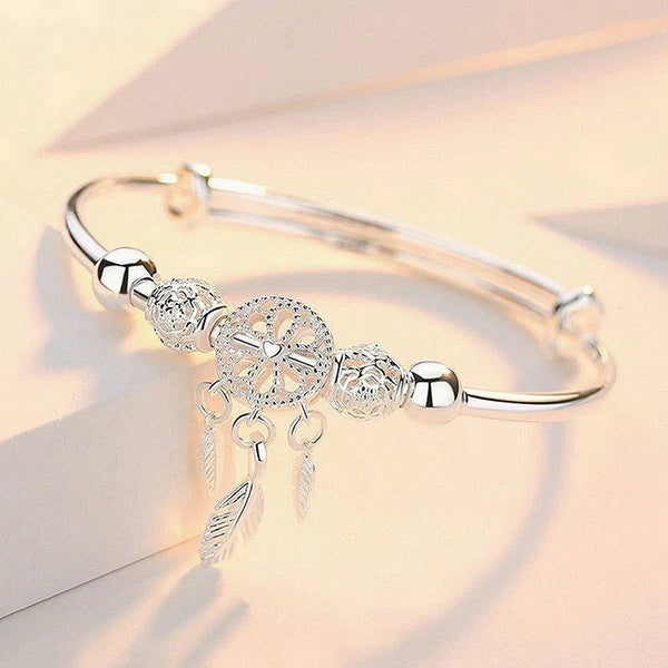 Silver Dreamcatcher Charm adjustable bangle bracelet for everyday wear, boho styling, and gift giving.