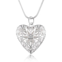 Silver heart locket photo pendant necklace for preserving a loved one’s image and special occasion wear.