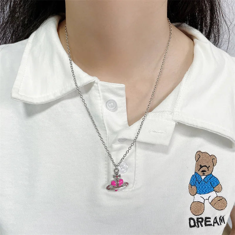 Trendy Silver Heart & Saturn Pendant necklace for women for everyday fashion, date night looks, and layered jewelry styling.