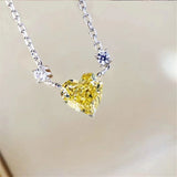 Silver heart zircon crystal pendant necklace for romantic outfit styling, evening wear, and jewelry gifting.