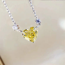 Silver heart zircon crystal pendant necklace for romantic outfit styling, evening wear, and jewelry gifting.