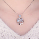 Silver Life Tree pendant with blue spinel gemstone for personal style, layering with necklaces, and gift giving.