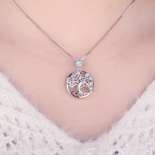 Silver Life Tree pendant with blue spinel gemstone for personal style, layering with necklaces, and gift giving.