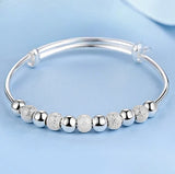 Silver Dreamcatcher Charm open bangle bracelet for easy wrist adjustment, casual wear, and layered jewelry looks.