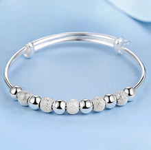 Silver Dreamcatcher Charm open bangle bracelet for easy wrist adjustment, casual wear, and layered jewelry looks.