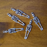 Skeleton charm for jewelry making, meditation malas, and gothic-themed accessories.