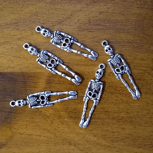 Skeleton charm for jewelry making, meditation malas, and gothic-themed accessories.