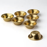 Small brass offering bowl set in Tibetan style for prayer table offerings, temple decor, and spiritual ceremonies.