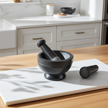 Soapstone gray and black 2-tone mortar and pestle set for grinding spices, herbs, and seasoning blends during kitchen prep.
