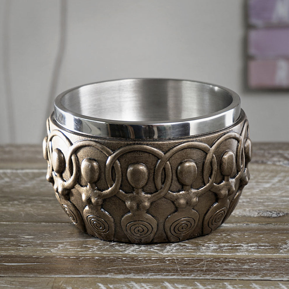 Spiral Goddess Smudge Bowl holding a lit smudge stick during a smoke cleansing ritual.