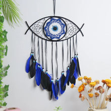 Spiritual Evil Eye dream catcher with blue feathers for ritual decor, protective symbolism, and serene home decoration.