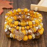 4Pcs Tree of Life Heart Bracelet Set with stackable bracelets for gift giving, daily fashion, and coordinated accessory wear.