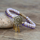 Stainless steel dream catcher bracelet with crystal charm for casual outfits, layered jewelry looks, and daily accessorizing.