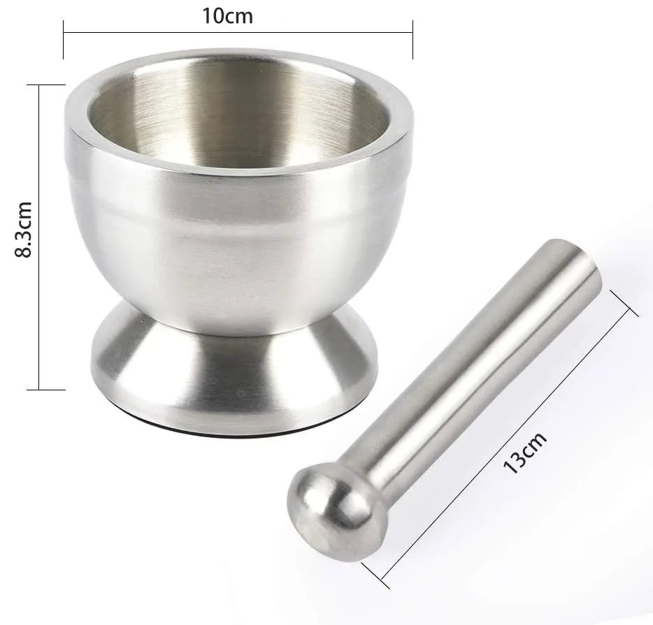 Stainless steel herb grinder mortar and pestle with lid for crushing fresh herbs, seeds, and spice mixes.