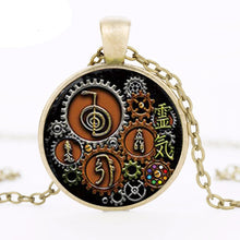 Steampunk Reiki glass cabochon pendant necklace for meditation, healing practice, and mystical fashion styling.