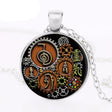Steampunk Reiki glass cabochon pendant jewelry piece for energy healing, spiritual wear, and everyday accessory styling.