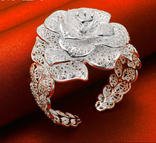 Sterling silver Camellia open cuff bracelet for dressing up casual outfits, gifting, and feminine accessory wear.