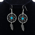 Sterling silver dreamcatcher earrings with dangling feather and bead