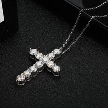 Sterling silver moissanite cross necklace with pendant for daily accessorizing, gifting, and elegant religious jewelry wear.