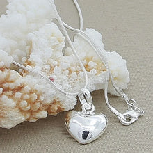 Sterling Silver small heart charm pendant for casual outfits, sentimental gifting, and simple jewelry looks.