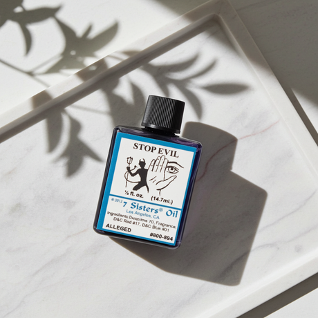 Stop Evil Wish Oil ritual oil bottle for warding off negativity, enemy work, and spiritual defense.