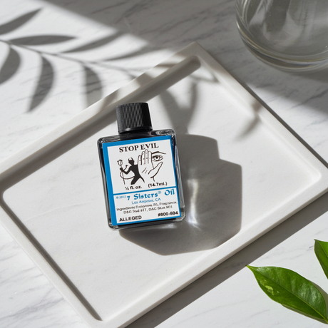 Stop Evil Wish Oil bottle for spiritual protection, curse removal, and ritual use.