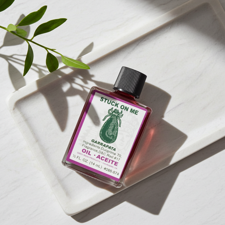 Stuck On Me Wish Oil spiritual dressing oil bottle for candle work, petition rituals, and attraction practice.