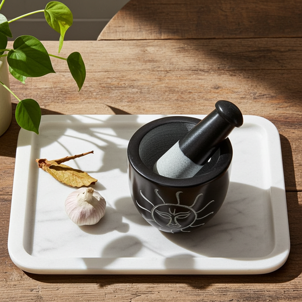 Sun Carved Black Soapstone mortar and pestle set for grinding herbs, spices, and fresh seasoning blends.