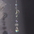 Suncatcher Crystal Star and Moon wall hanging with crystal accents for window décor, light reflection, and home decoration.