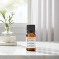 Tea Tree Essential Oil bottle for skin care aromatherapy, natural cleaning, and wellness support use.