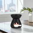 Black Ceramic Tealight Wax & Oil Burner oil warmer for scented oils, wax melts, and creating a cozy home fragrance setting.