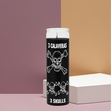 Three Skull black devotional candle in glass for spellwork, spiritual focus, and ritual practice.