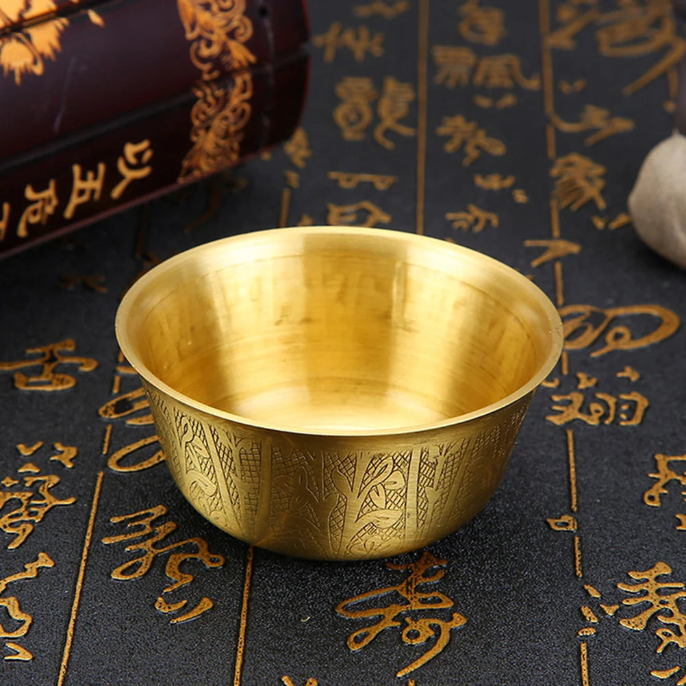 Tibetan copper offering bowl with golden finish for shrine offerings, meditation practice, and spiritual rituals.