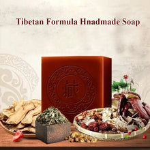 Tibetan Herbal Handmade Black Soap with natural herbs and ingredients on wooden display surface.