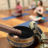 Tibetan Singing Bowl 8cm metal bowl with wooden stick for yoga, relaxation, and calming ritual use.