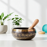 Tibetan singing bowl with wooden striker for yoga sessions, relaxation, and calming sound therapy.