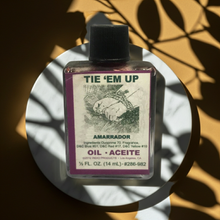 Tie Em Up Wish Oil bottle for altar work, spell use, and relationship-focused rituals.