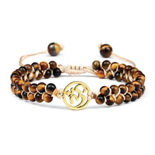 Tiger Eye crystal stretch bracelet with hanging charm for comfortable wrist wear, gemstone accessory use, and everyday fashion.