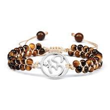 Tiger Eye gemstone wrist bracelet with charm for everyday accessorizing, crystal-inspired fashion, and layered bracelet wear.