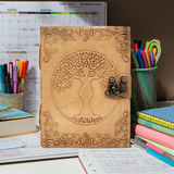 Tree Goddess embossed leather journal notebook with latch closure for note-taking, journaling, and personal reflection.