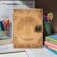 Tree Goddess leather journal with latch closure for writing, sketching, and daily journaling.