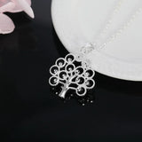 Tree of Life Heart pendant in 925 sterling silver for elegant outfit styling, meaningful occasions, and personal jewelry wear.