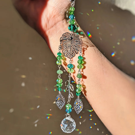 Tree of Life leaf shape sun catcher hanging decor for brightening windows, catching sunlight, and decorative indoor display.