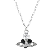 Trendy Silver Heart & Saturn Pendant necklace for chic everyday wear, layered looks, and fashion-forward accessorizing.