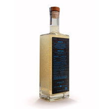 Tub Club Tobacco Vanilla bubble soak lifestyle view in black glass bottle