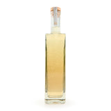 Tub Club Tobacco Vanilla white glass bottle bubble soak fragrance display for evening bath ritual and gifting.