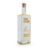 Tub Club Tobacco Vanilla white glass bubble soak bottle showing label and small-batch Utah handcrafted detail.